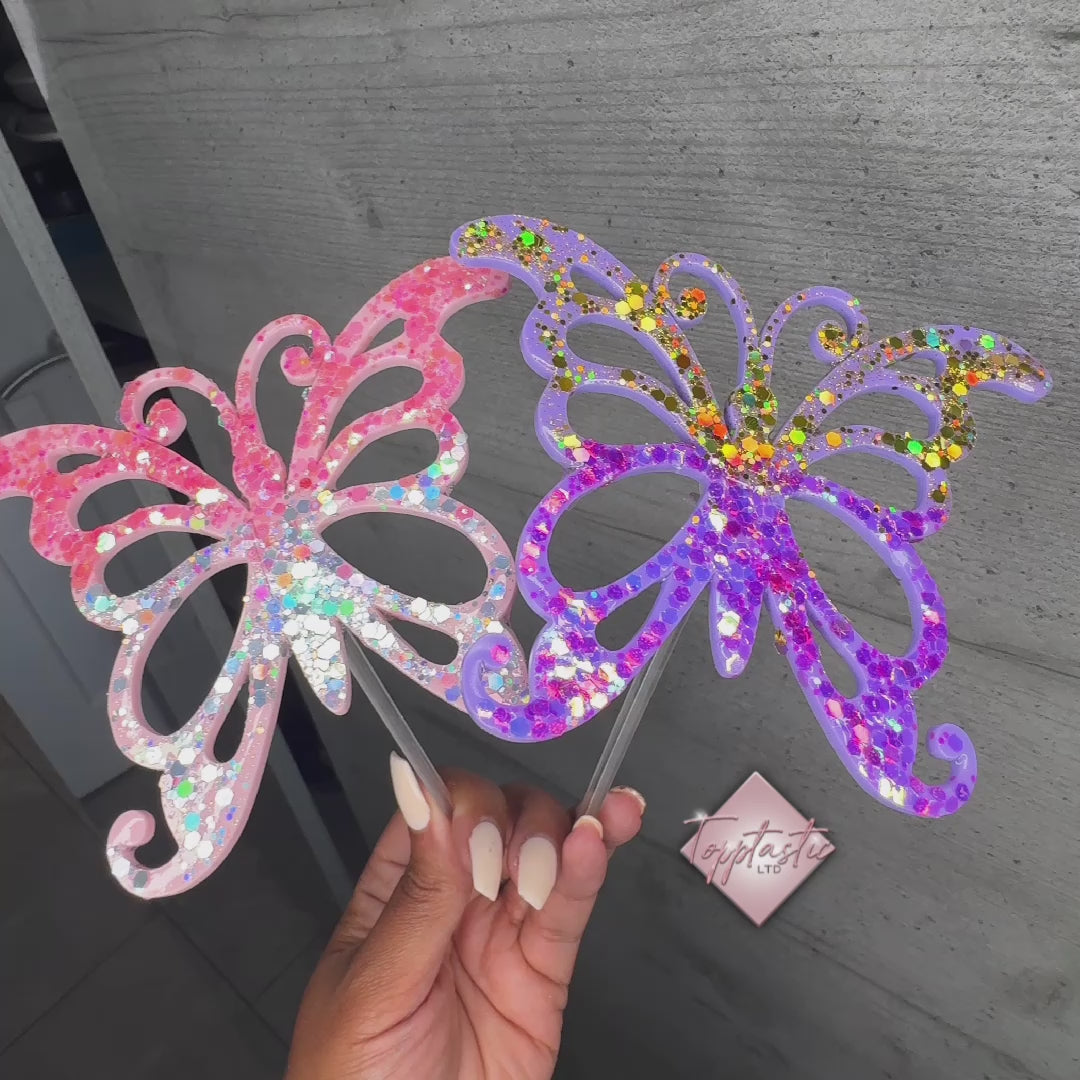 Glitter- filled acrylic butterflies on prong